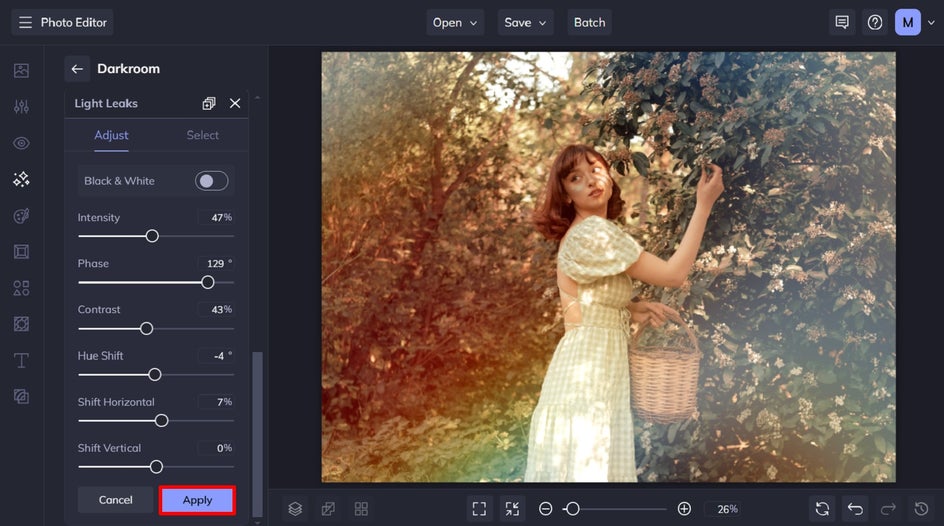 adjust and apply rainbow light leaks to portrait of female in orchard